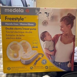 Medela Freestyle Yellow and White Breast Pump